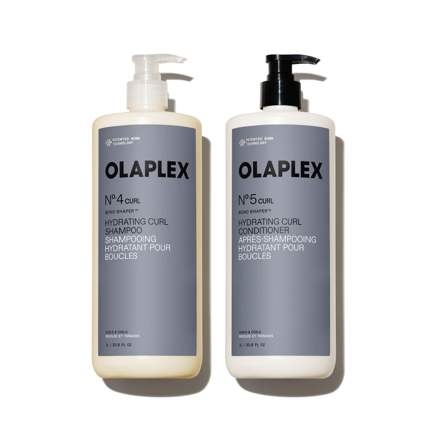 A liter-size set featuring OLAPLEX Nº.4CURL Bond Shaper Hydrating Curl Shampoo and Nº.5CURL Bond Shaper Hydrating Curl Conditioner. Both 1L / 33.8 fl oz bottles feature pump dispensers and are labeled for coils, curls, and waves.